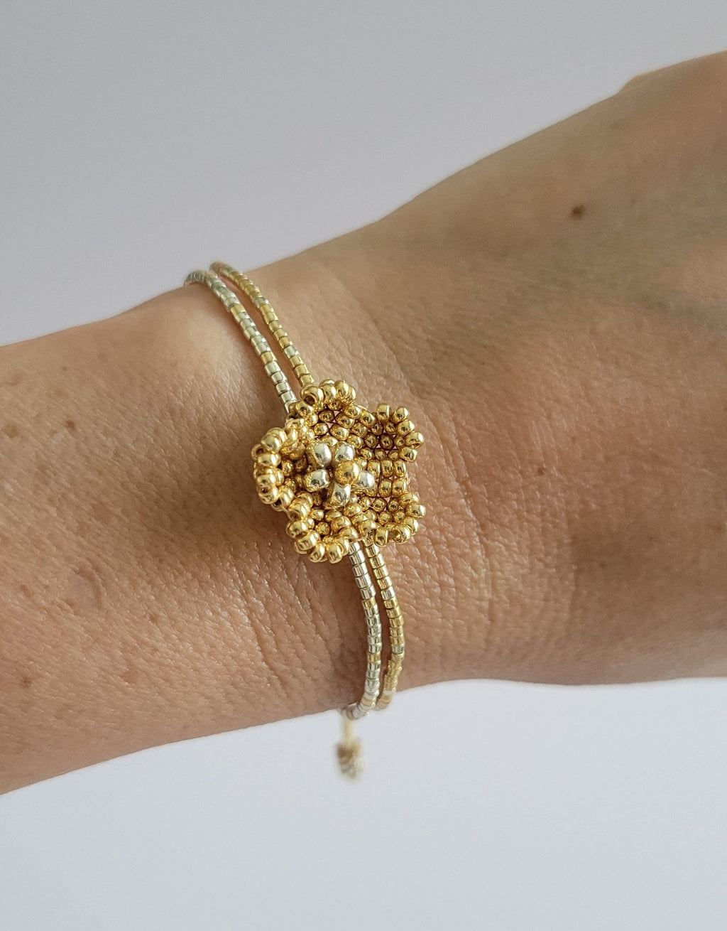 Little Bloom Bracelet in Golden Glow, worn on model – handwoven Miyuki jewelry by Franchesca Jewels