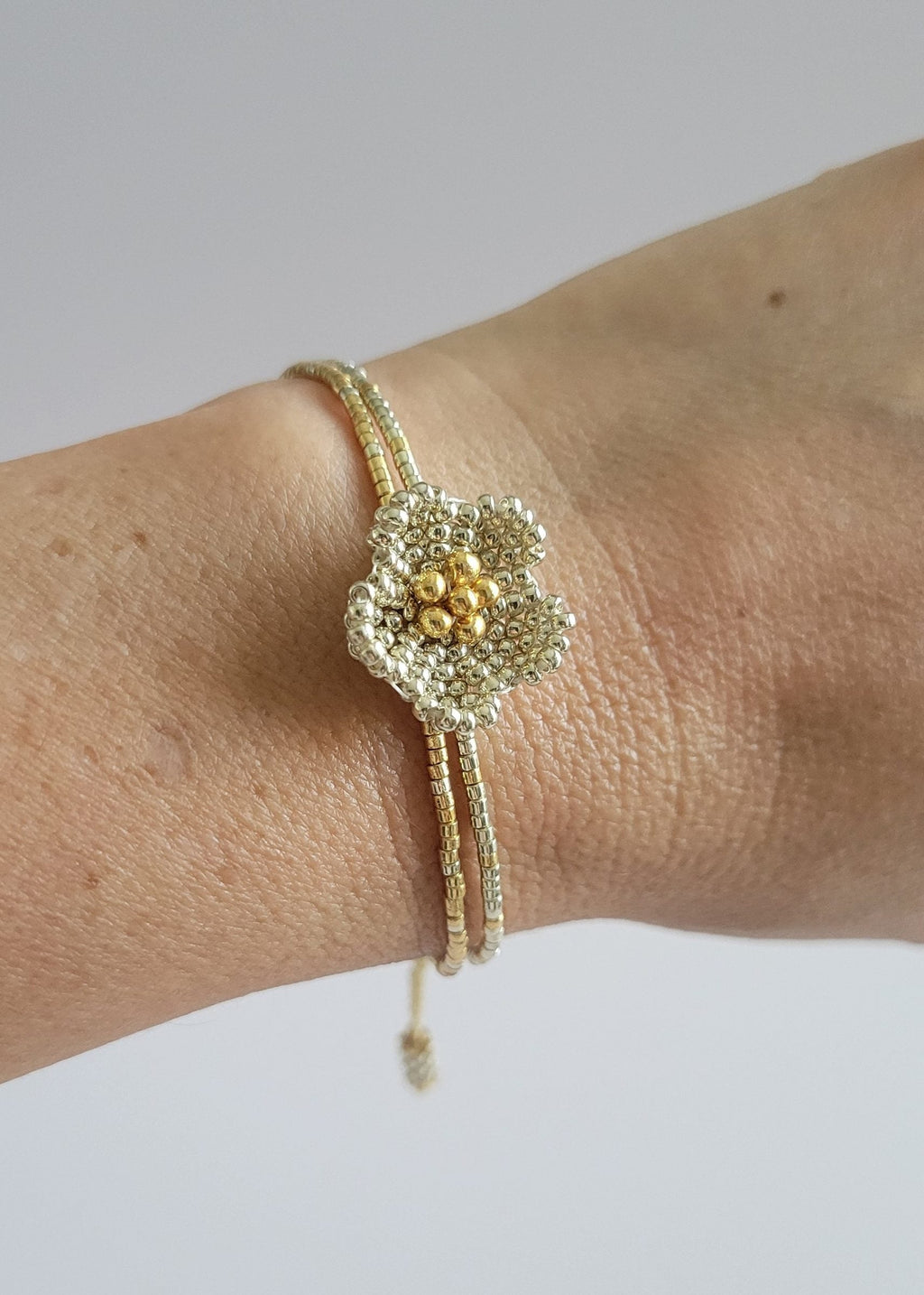 Little Bloom Bracelet in Silver, worn on model – handwoven Miyuki jewelry by Franchesca Jewels