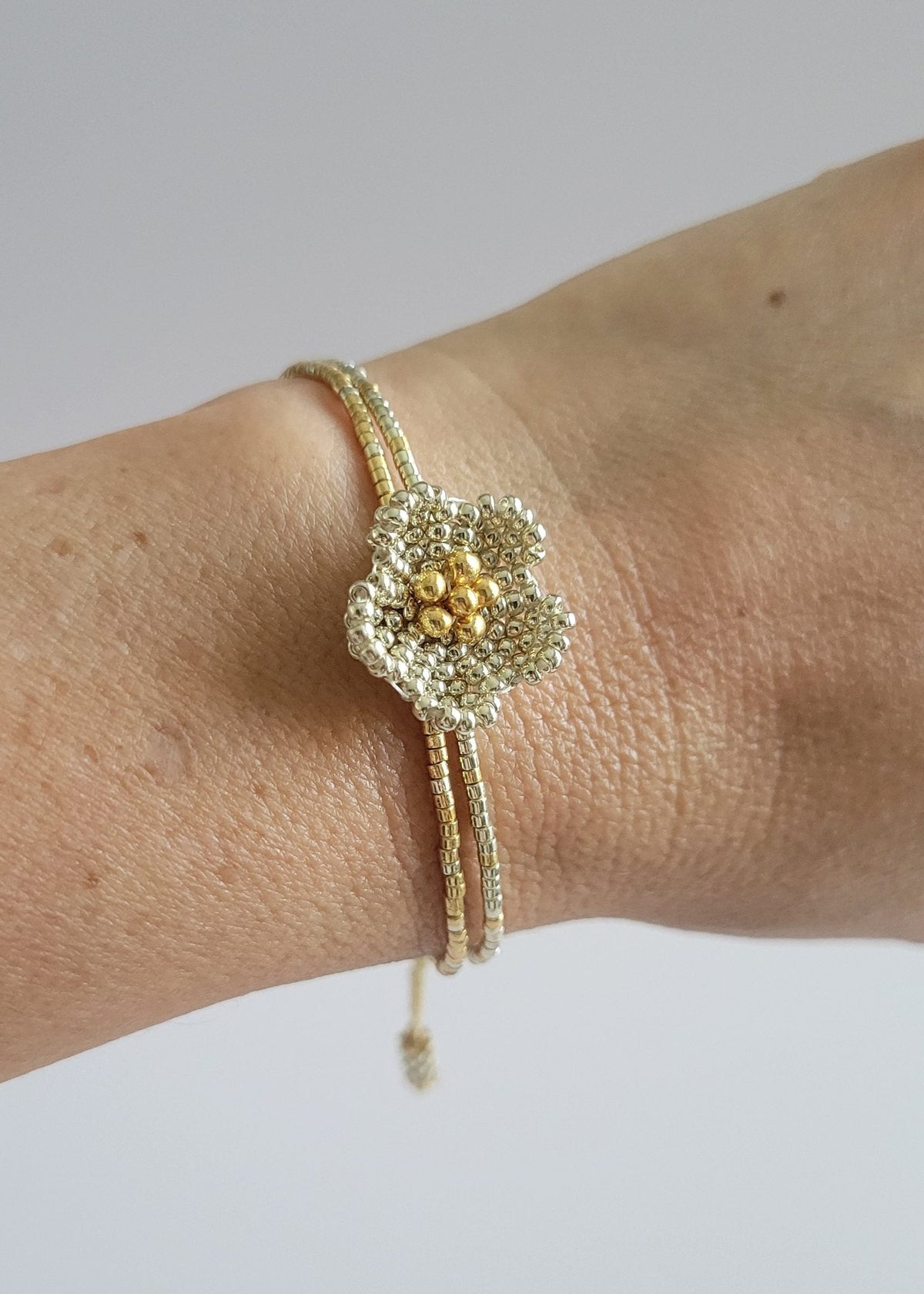 Little Bloom Bracelet in Silver, worn on model – handwoven Miyuki jewelry by Franchesca Jewels