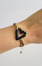 The Love Knot Bracelet in Blue Montana, worn on model – handwoven Miyuki jewelry by Franchesca Jewels