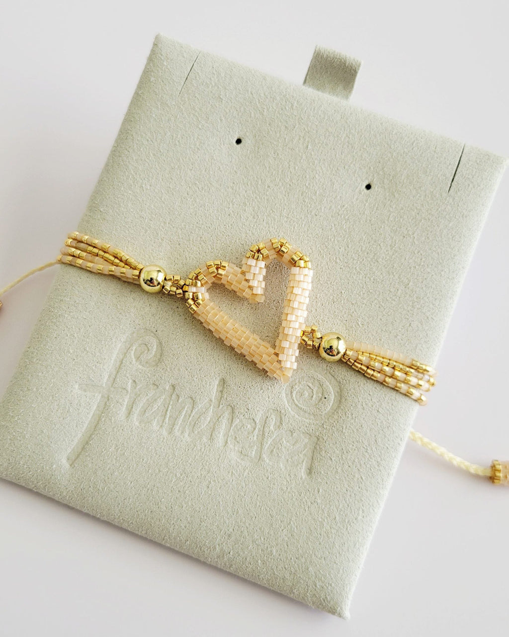 The Love Knot Bracelet in Champagne, handwoven with Miyuki beads by Franchesca Jewels