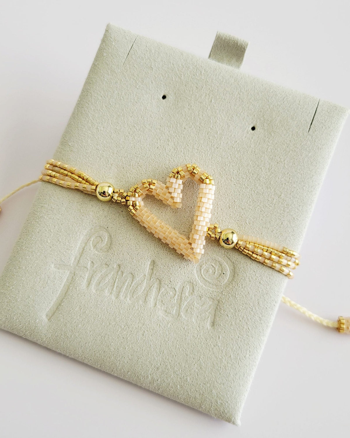 The Love Knot Bracelet in Champagne, handwoven with Miyuki beads by Franchesca Jewels