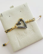 The Love Knot Bracelet in Graphite Luxe, handwoven with Miyuki beads by Franchesca Jewels