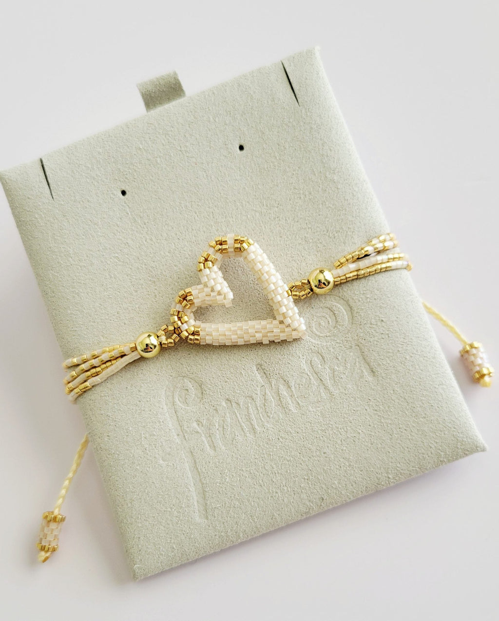 The Love Knot Bracelet in Ivory Pearl, handwoven with Miyuki beads by Franchesca Jewels